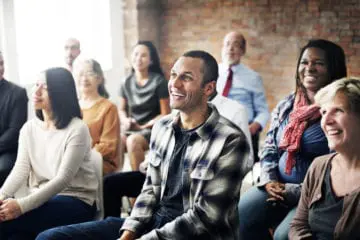 Group of diverse people attending a support group session for mental health.