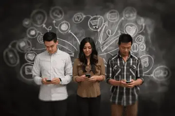 Young adults using smartphones with digital icons in the background.
