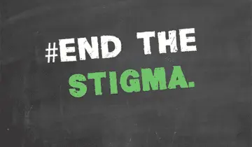 Chalkboard with #EndTheStigma message in white and green.