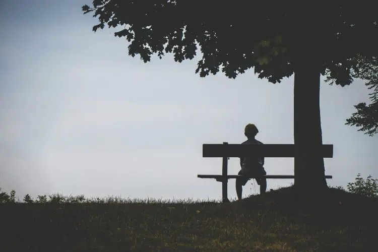 Man sitting on park bench
