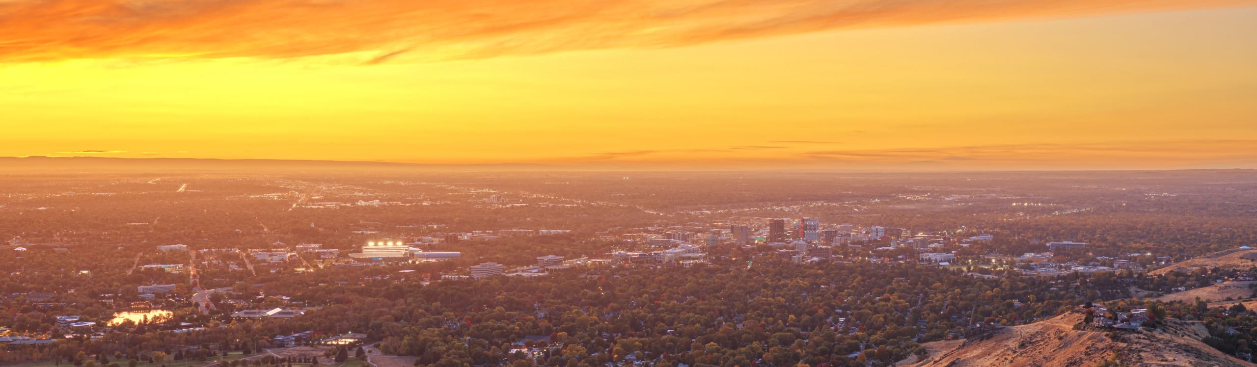 Boise, Idaho, USA view towards downtown from the mountains at dusk.