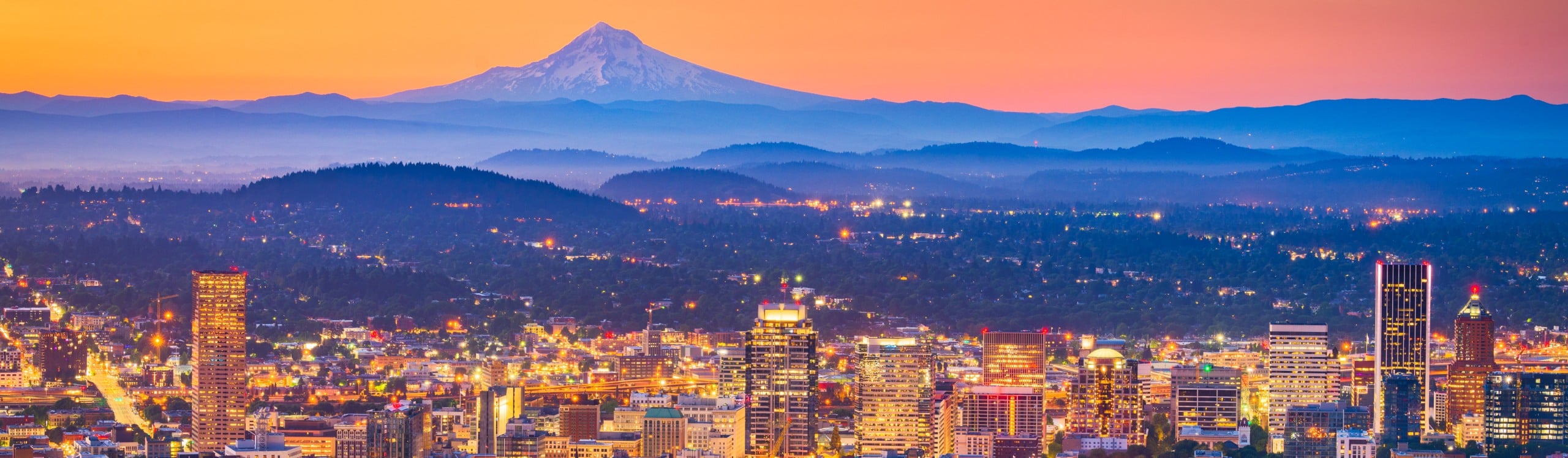 Portland, Oregon, USA downtown skyline with Mt. Hood at dawn.