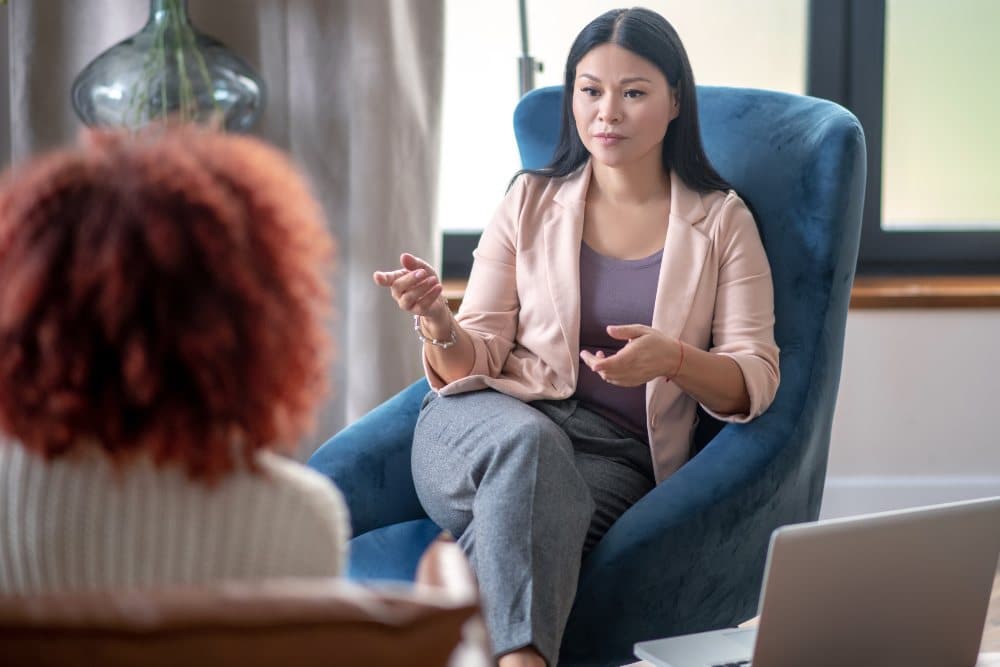 psychologist speaking with client