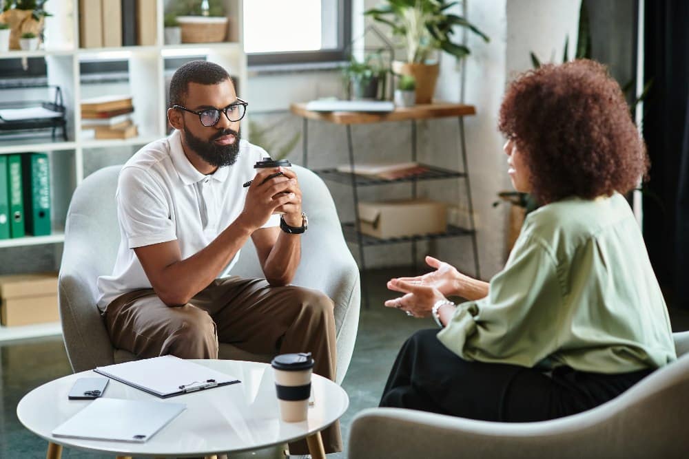 Two young professionals engage in a dynamic conversation