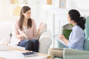 woman speaking to therapist