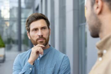 Is OCD neurodivergent? A man listening to someone else.
